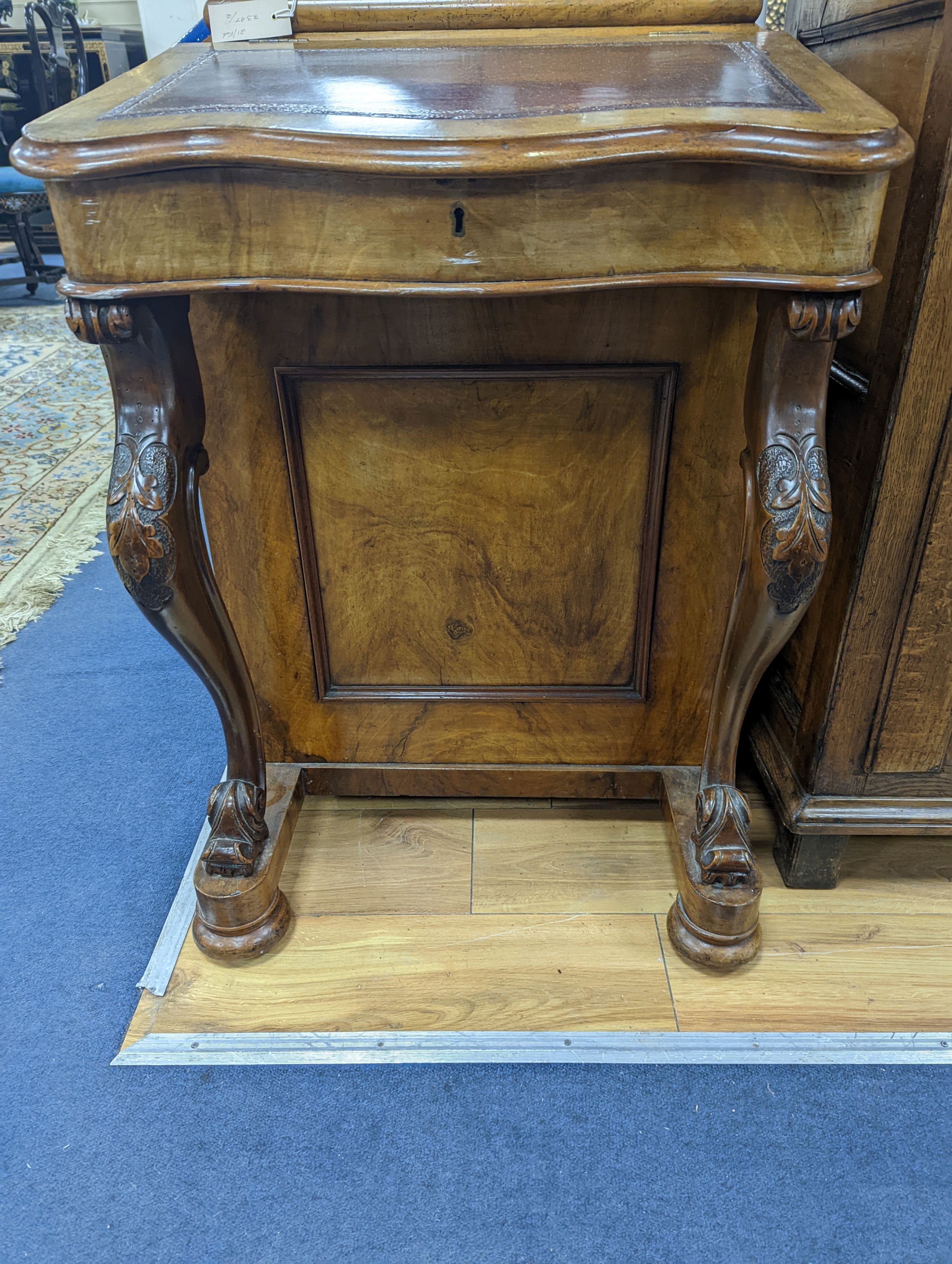 A Victorian walnut Serpentine fronted Davenport, width 55cm